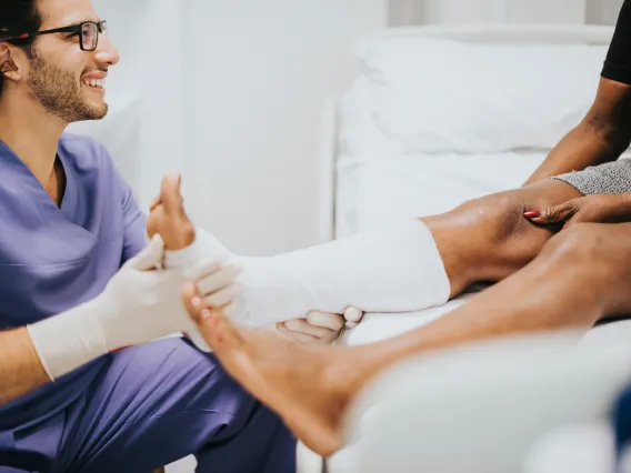 doctor helping patient