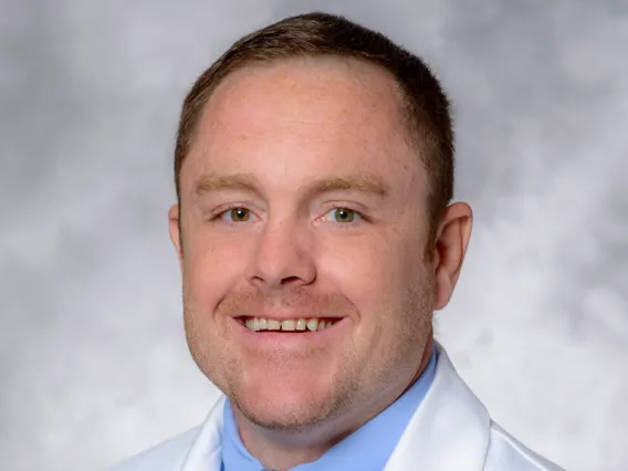 Travis Hughes, MD