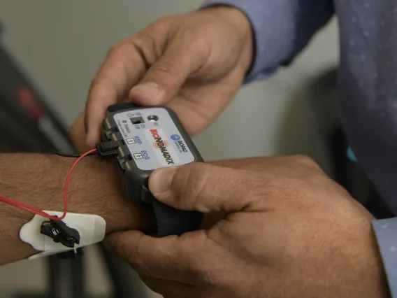Person reads information from a sensor worn on the forearm