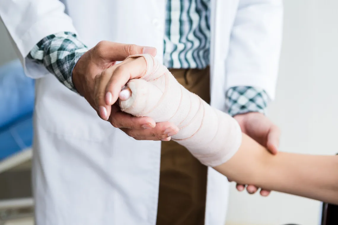 Doctor holding patient hand