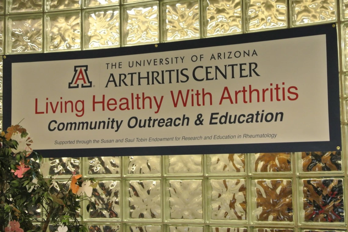 Sign for the University of Arizona Arthritis Center lecture series titled "Living Healthy with Arthritis"