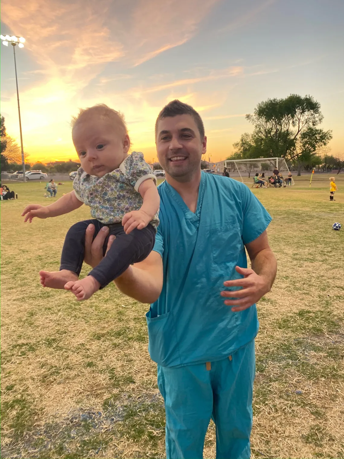 UA Ortho family baby on soccer field