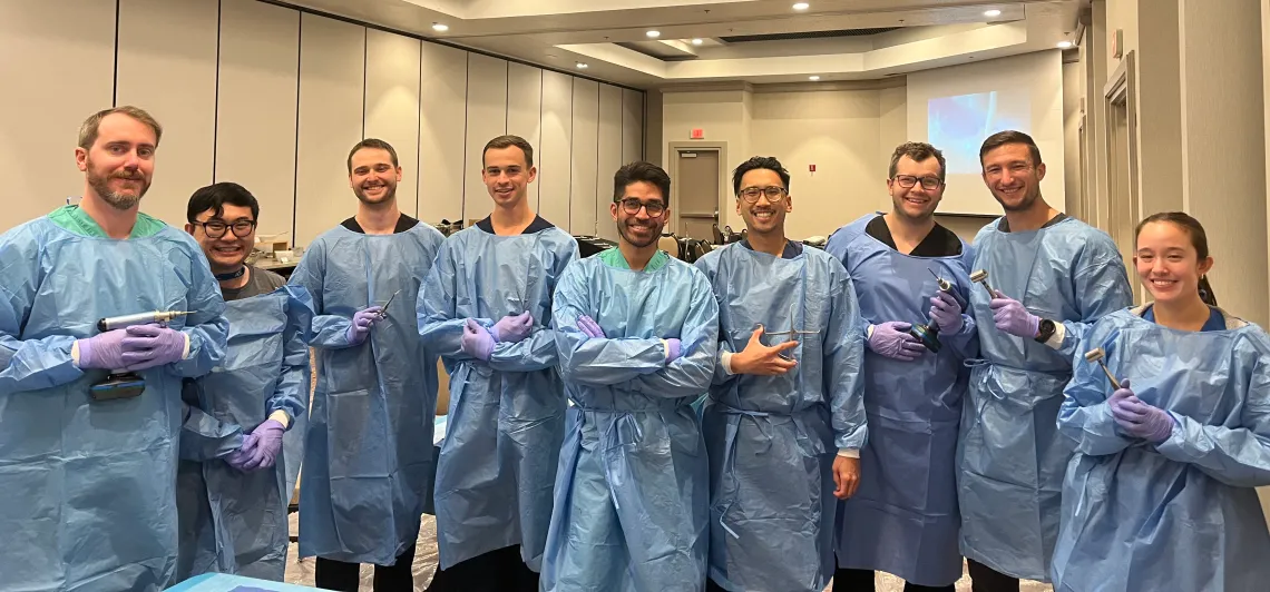 Photo of Thomas Roberts, MD, Benzi Estipona MD, Nathan Sherman, MD, Austin Post, MD, Mo Abbas, MD, Martin Lu, MD, Matthew Miller, MD, Brian Richard, MD and medical student, Deborah Nelson, MS4 – named from left to right.