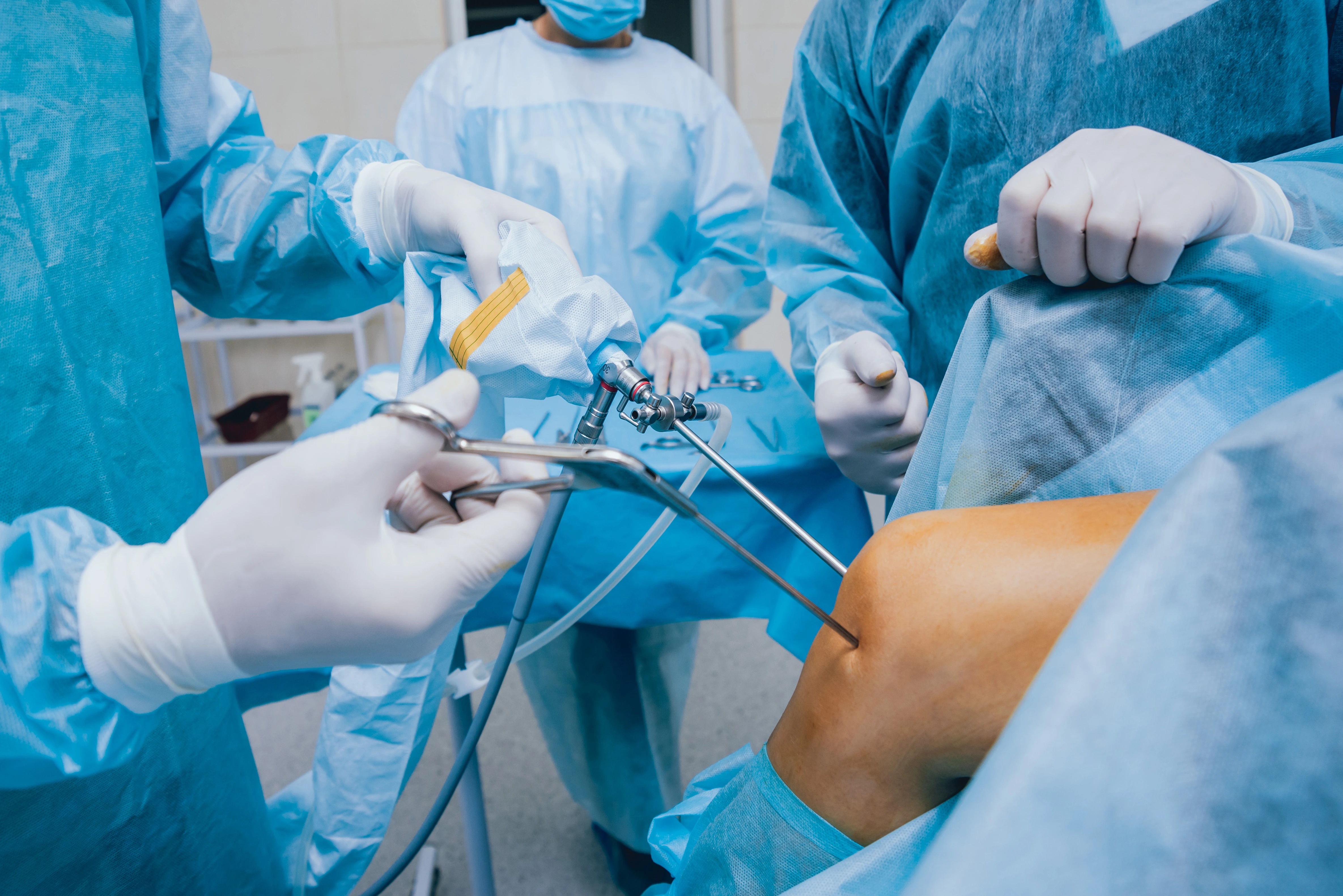 A knee arthroscopy being performed in an operating room.