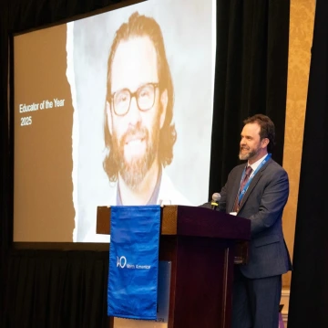 Photo of Dr. Jason Lowe speaking at the One AO 2025 conference